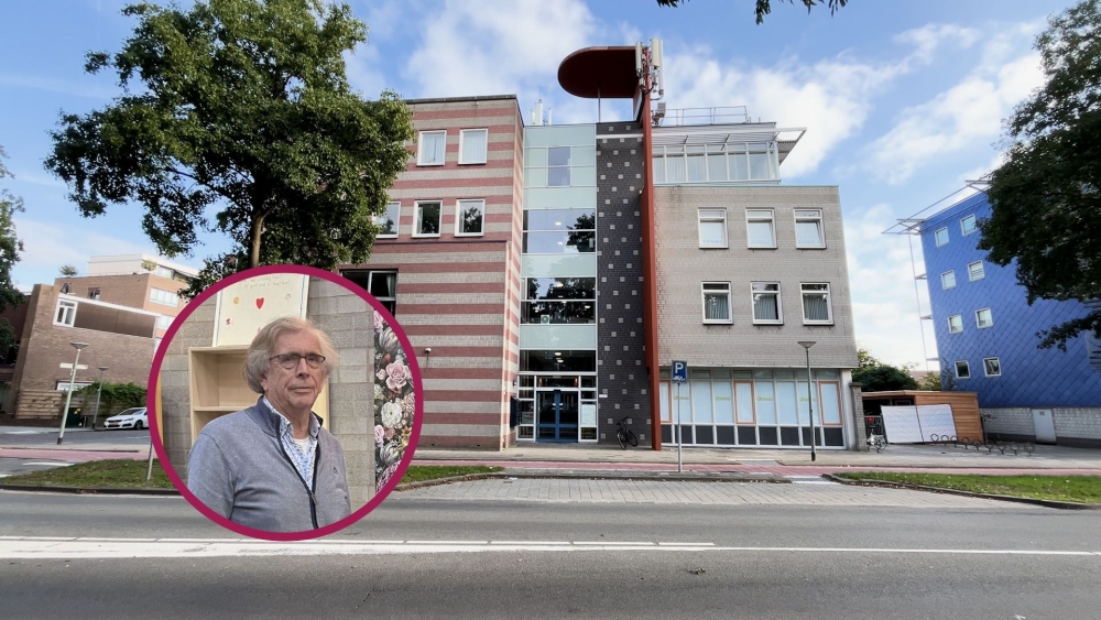 Voorzitter Buurtpunt Groot Ambacht Hans Riemens en het pand aan de Rotterdamseweg