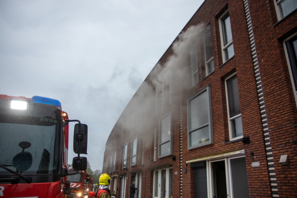 Wasmachine in brand: woning vol rook